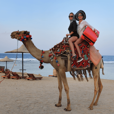 15-Must-Pack Items-Morocco-Trip-Women-on-Camel-Morocco-Travel-Blog