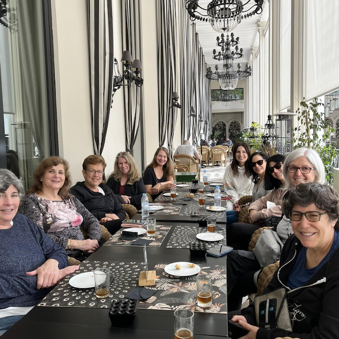 Group of women over 50 enjoying rooftop dinner in Casablanca on a Travel Exploration women’s luxury tour