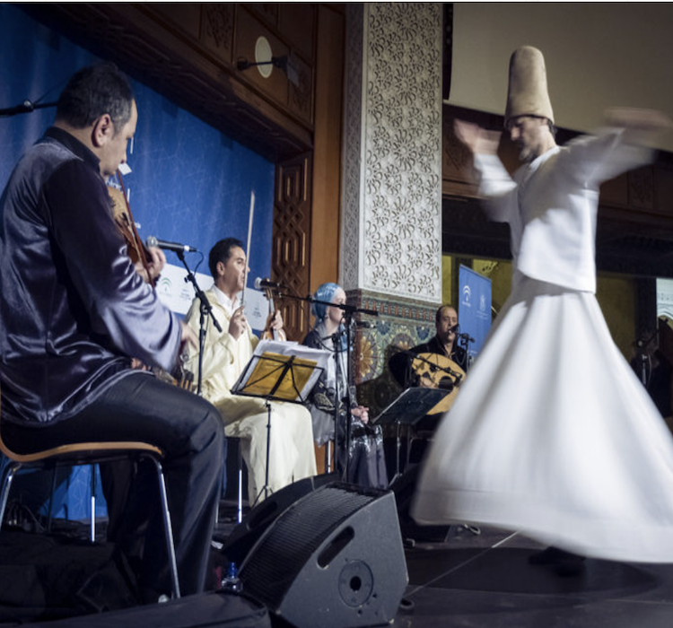 Hamid Ajbar Sufi Ensemble performing Andalusian music with a whirling Sufi dancer
